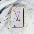 Whale fin necklace